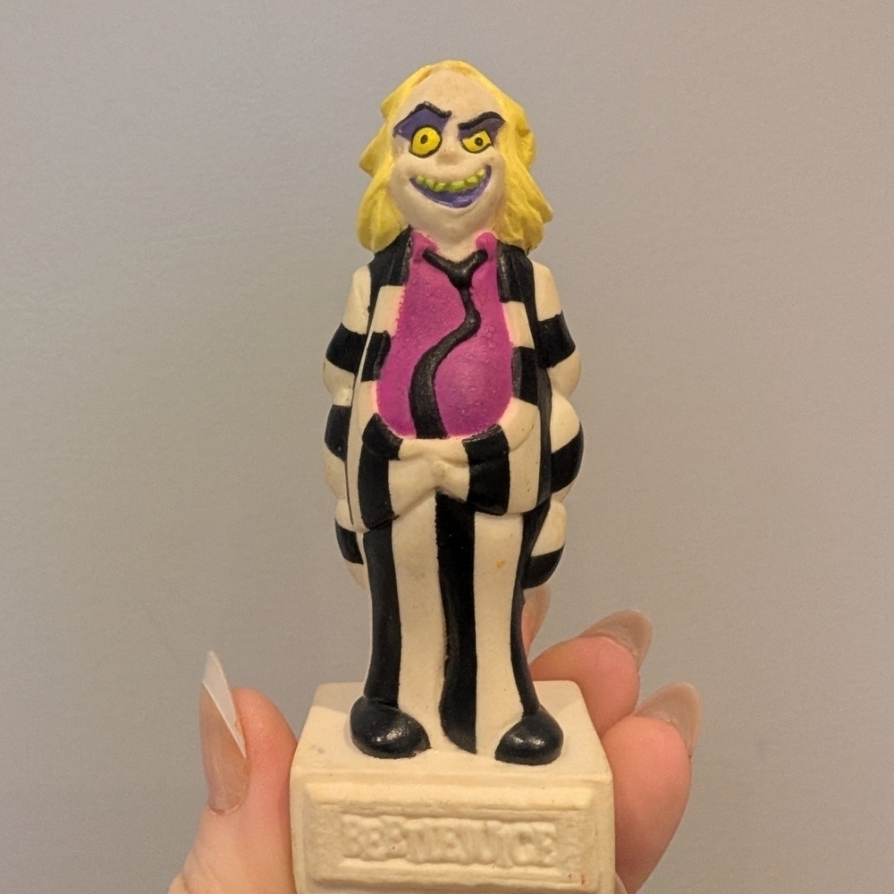 Striped Figurine with Purple Shirt